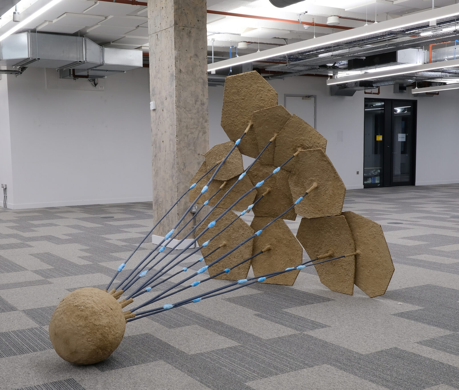 Eleanor Bedlow, Conscious of the Connections (2025) cardboard, cardboard pulp, bamboo, acrylic, plaster, 185 x 250 x 176cm